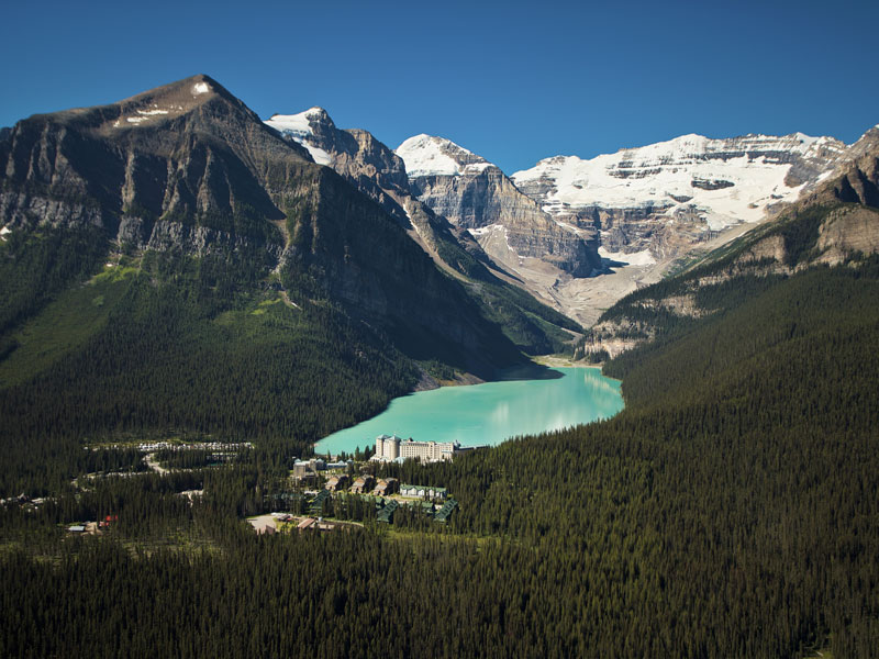 Majestic Canada Train Vacation through the Rockies | Fairmont Chateau Lake Louise with Victoria Glacier