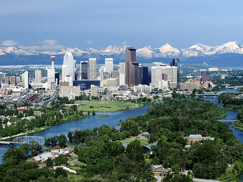 Canada Train Vacations | Calgary with the Rocky Mountains as a backdrop